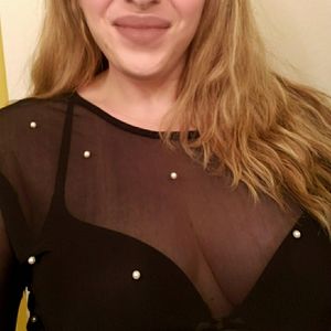 Festive sheer black top with embossed pearls worn once